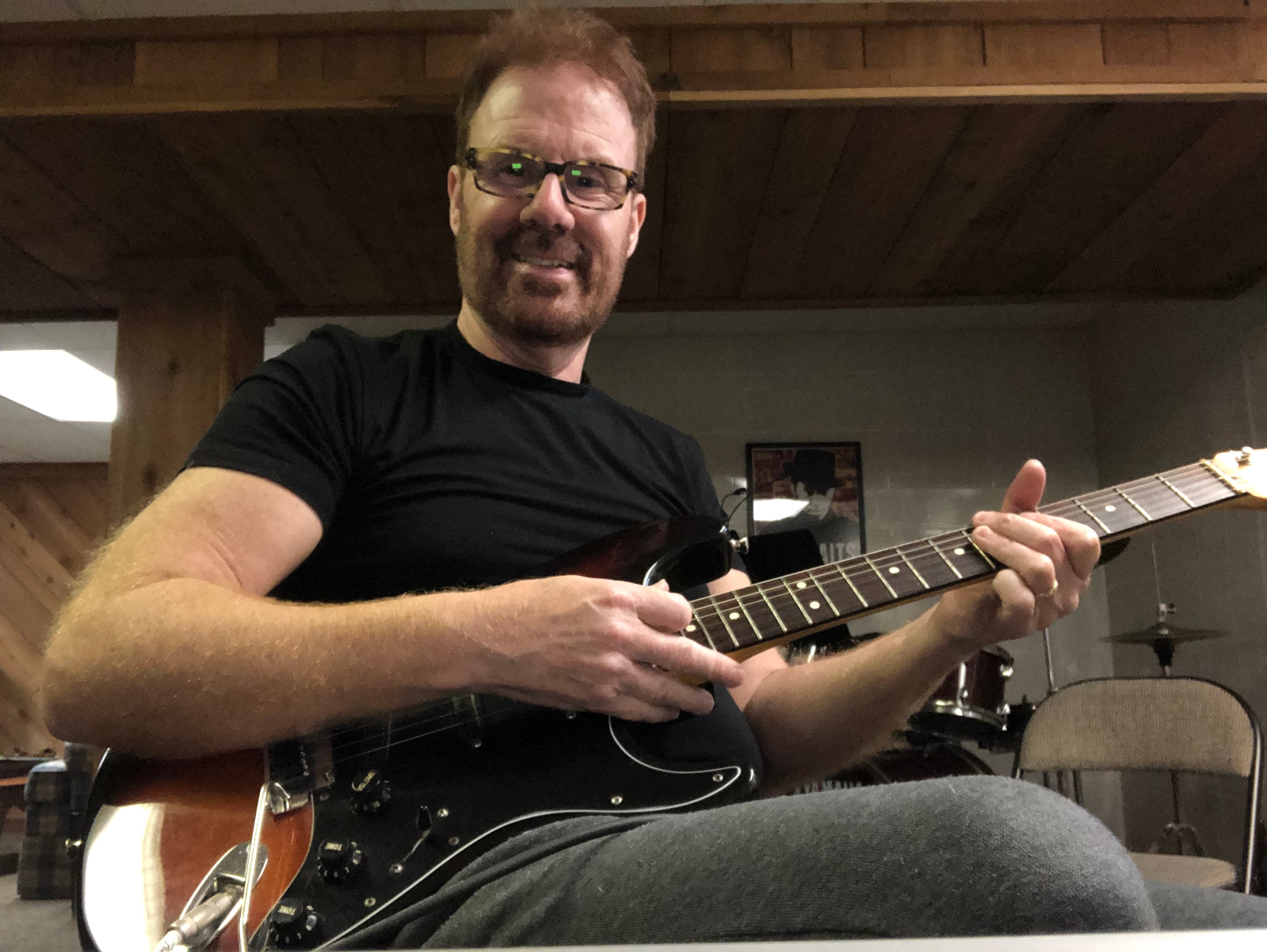 Marty Reidell playing electric guitar in the studio